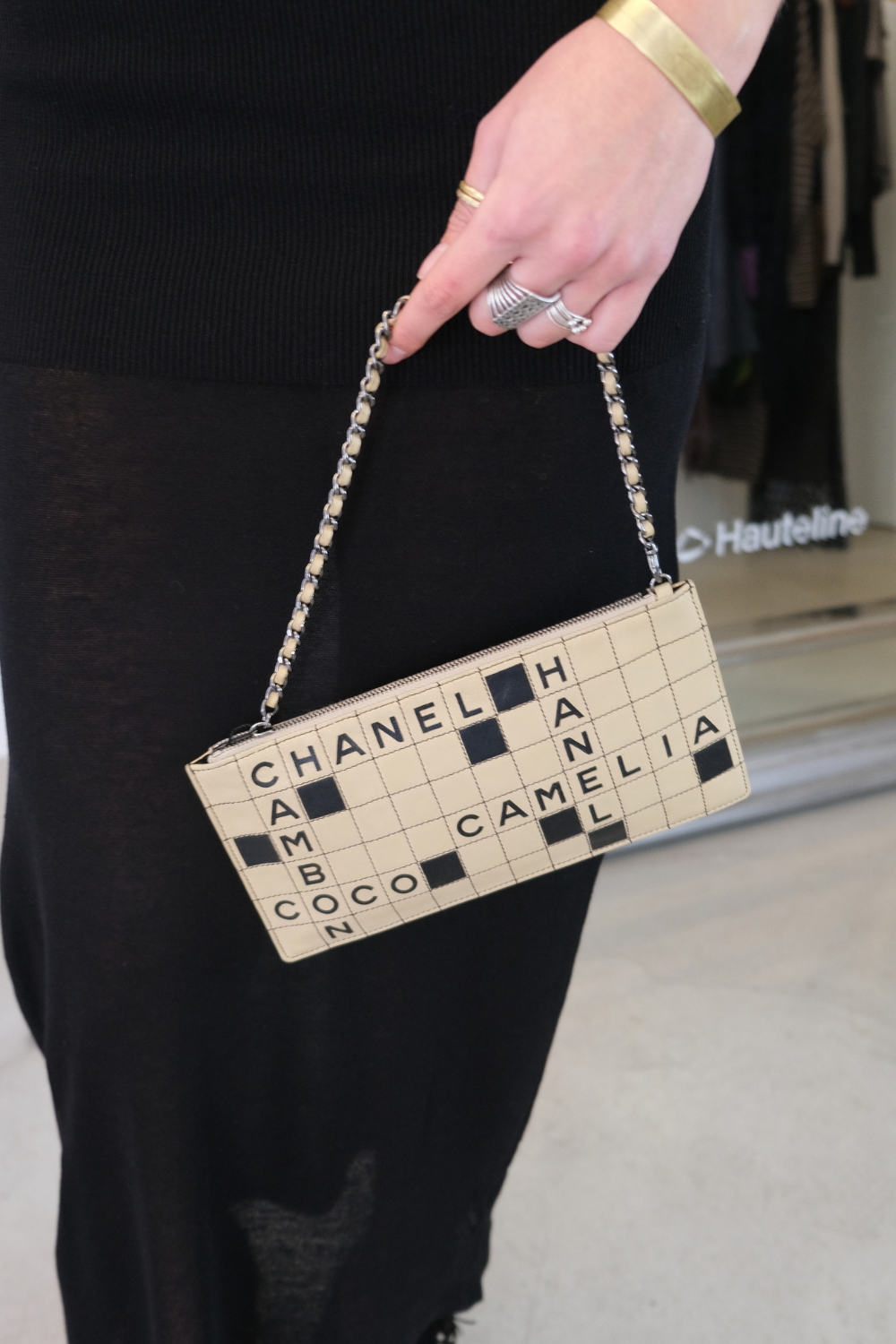 Chanel Crossword Logo Pochette Bag - Rent from Hauteline Chanel Crossword Logo Pochette Bag - Rent from Hauteline