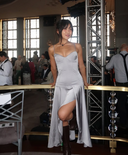 @journalbymoon wearing the Fanci Club Clavicle Corset Midi Dress, a structured corset midi dress with a fitted silhouette, styled for an elevated night-out look. Rented from Hauteline.