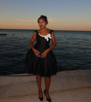customer wearing the bow detail dress for a wedding guest look