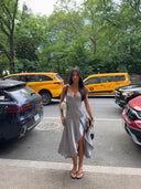 customer wearing the Fanci Club Clavicle Corset Midi Dress, a structured corset midi dress with a fitted silhouette, styled for an elevated night-out look. Rented from Hauteline.