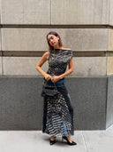 Customer wearing the Mesh Maxi Dress Polka Dot Zip, a semi-sheer mesh maxi dress with a polka dot print, zip-front detail, and raw-edge design, styled for a bold, fashion-forward event look.