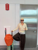 @chloe.felopulos styling the I Heart Me Hoodie for a cool girl travel airport look.
