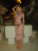 @maddieweidman wearing the Anna Sui Crushed Satin Ruffle Midi Skirt and matching top, styled for an elegant daytime or evening outfit. Rented from Hauteline