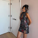 customer wearing the sau lee eva dress, styled for a night out