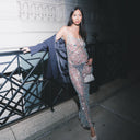 @itsmesarat wearing the Fishnet Maxi Dress Blue Unlined, a semi-sheer mesh maxi dress with hand-embellished beads, crystals, and sequins, styled for a statement event or fashion-forward evening look. 